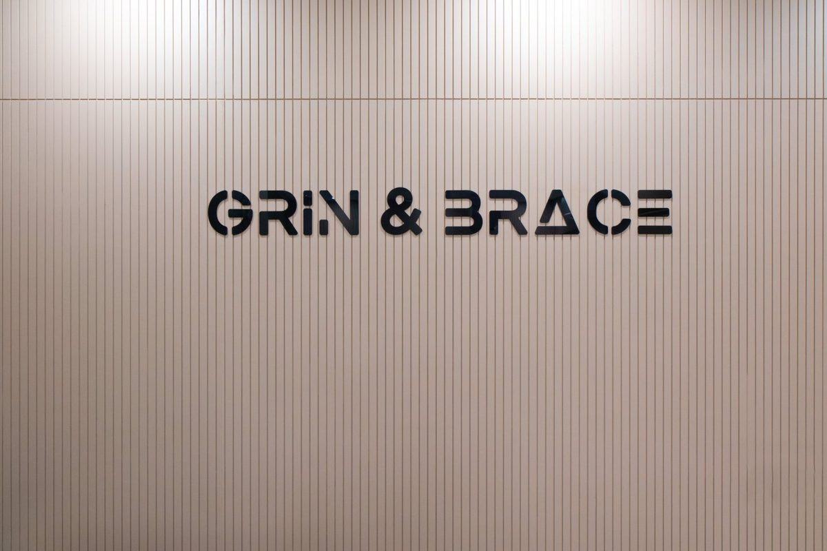 Grin & Brace wordmark on interior wall